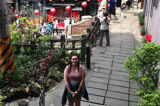 Photo of a young woman posing in a garden in Taiwan