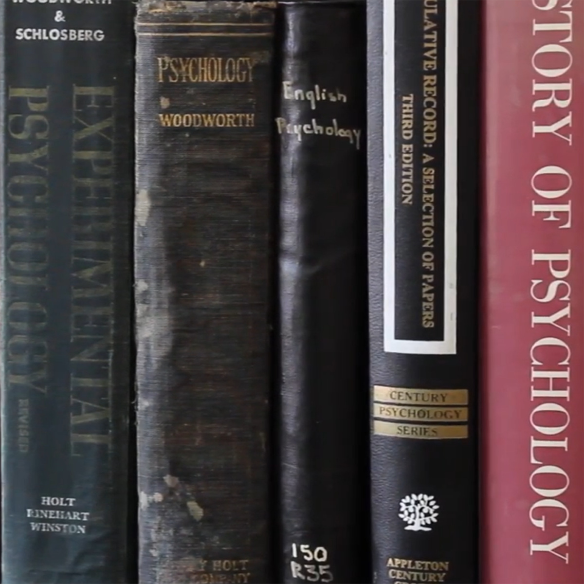 Close-up photo of philosophy book spines, on a shelf