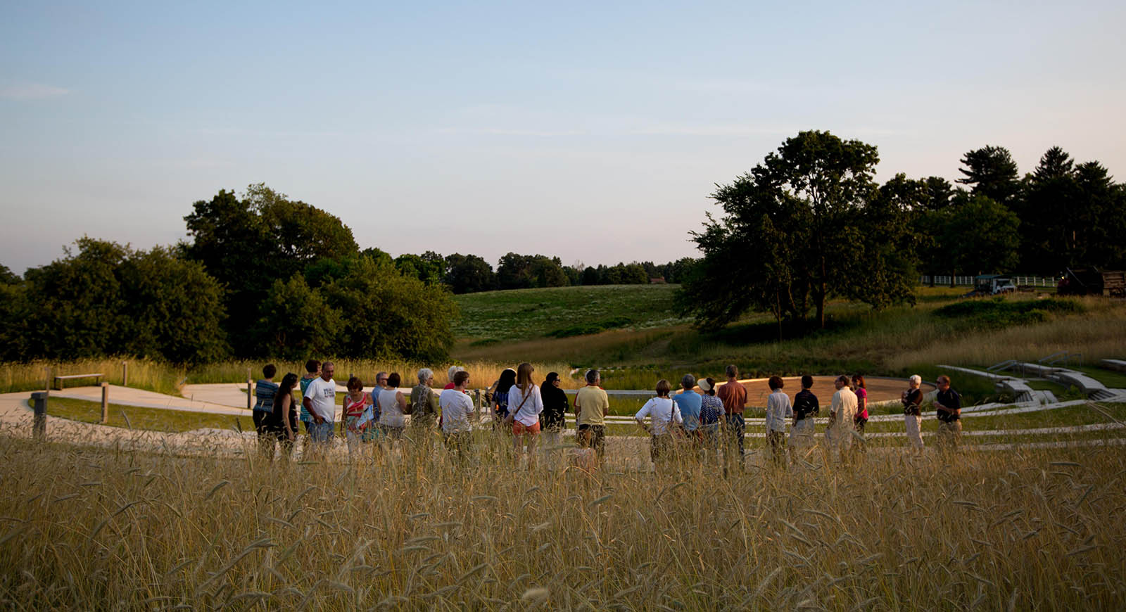 Photo of a group of people standing outside in a field on Eden Hall Campus