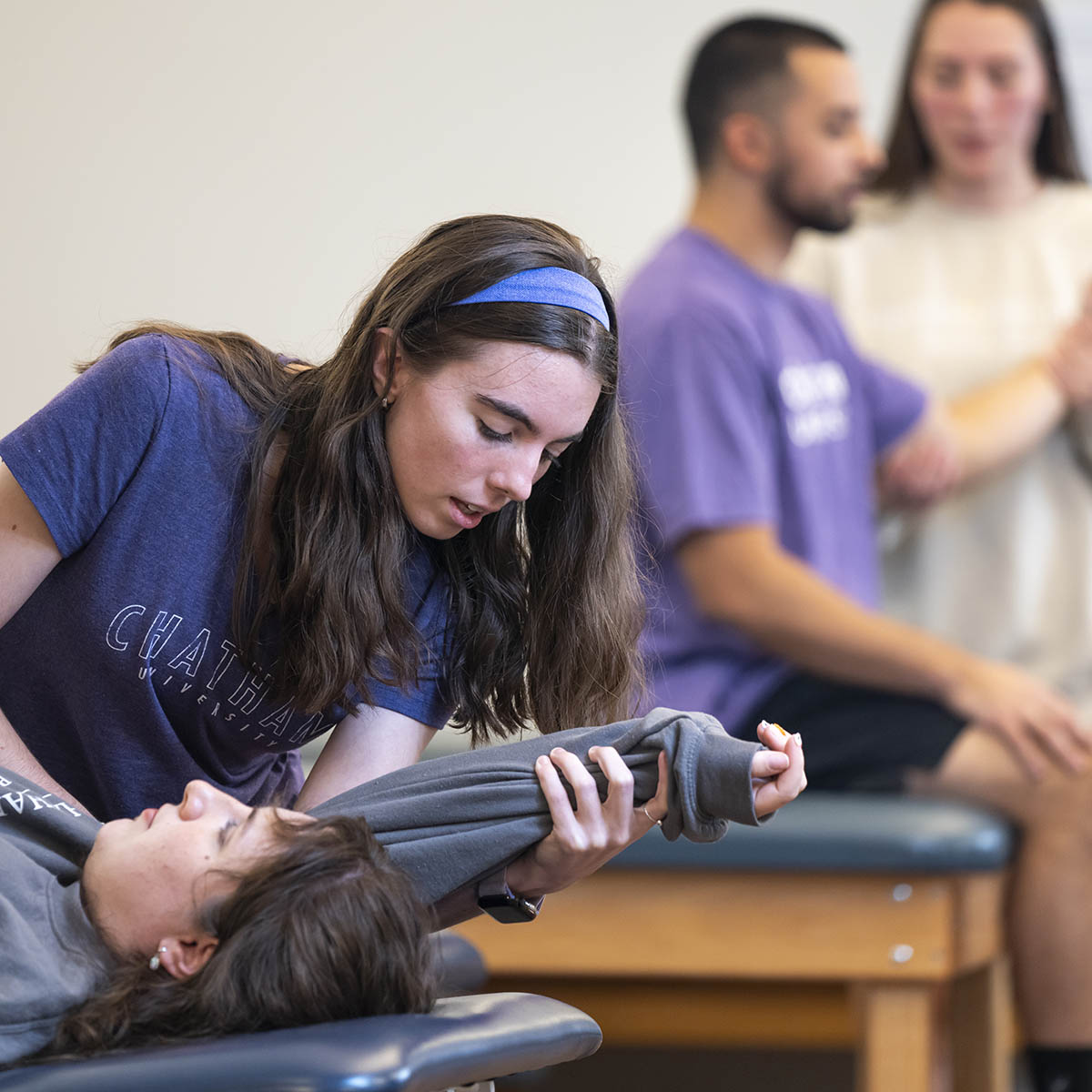 Physician Assistant Studies student testing reflexes in a lab