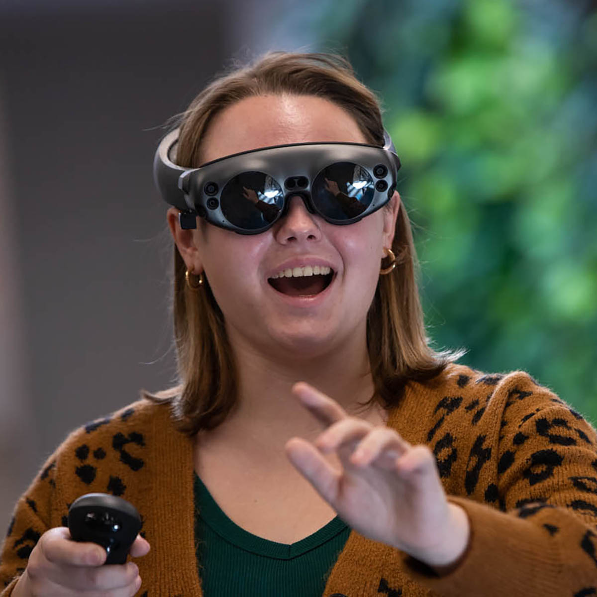 Photo of a student in virtual reality goggles