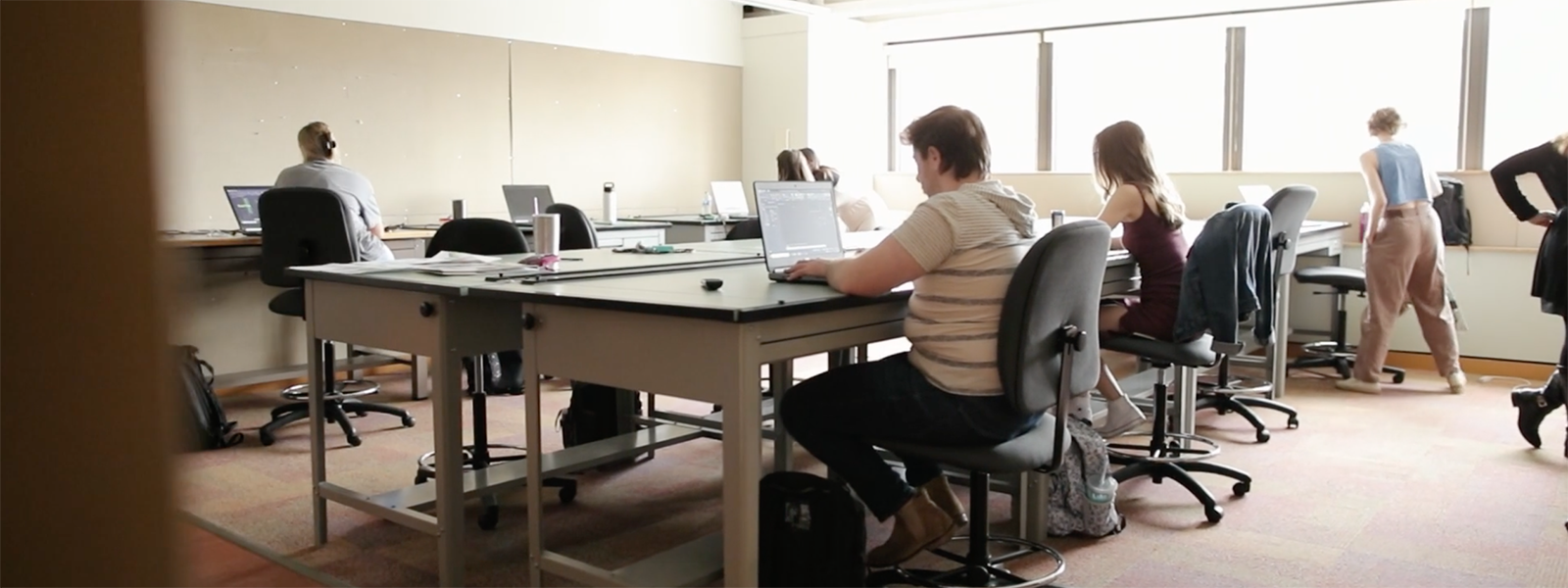 Photo of an interior architecture studio classroom with students working