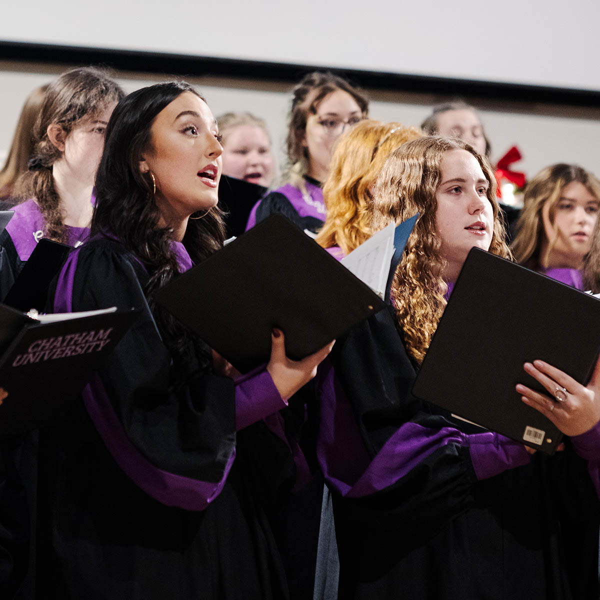 Students in Chatham’s vocal ensemble sing at the University’s Candlelight celebration.