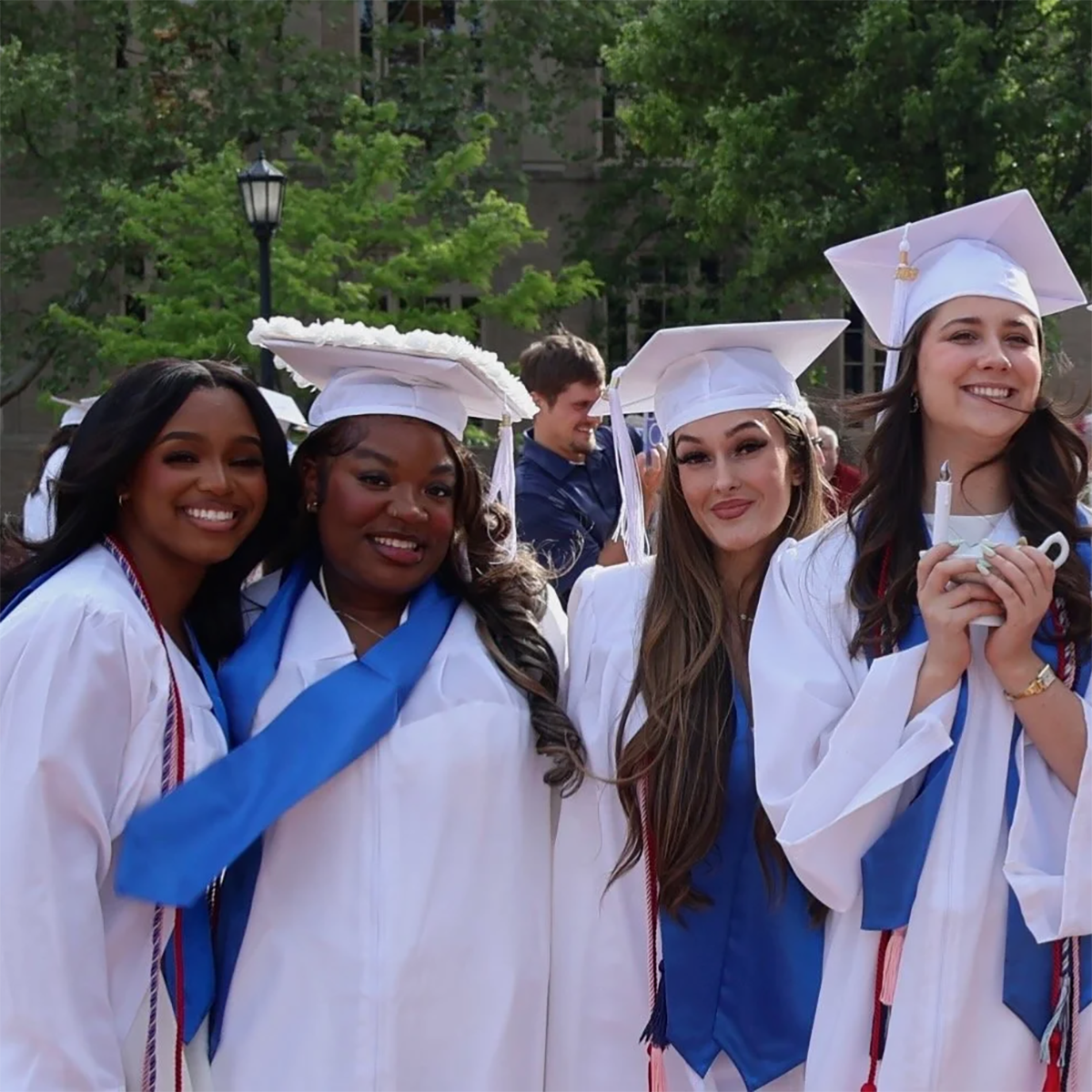 Marcus, second from left, poses with classmates for a photo at her Shadyside School of Nursing graduation.