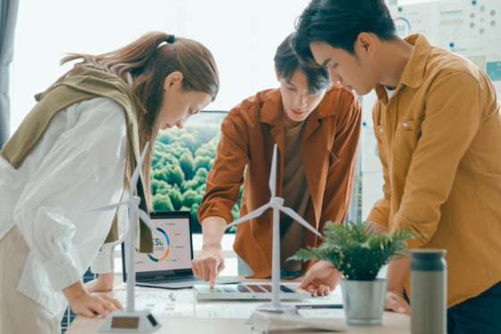 Professionals discuss sustainable design options with solar and wind energy