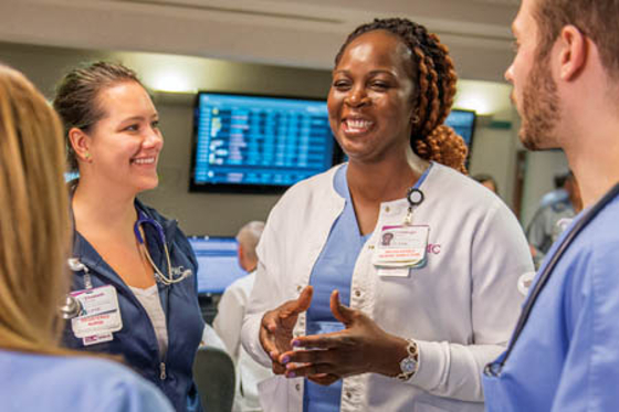 Photo of a group of nurses speaking together in a hospital