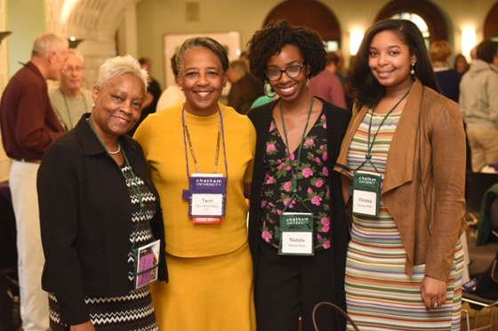 Photo of four Chatham University women smiling at an event