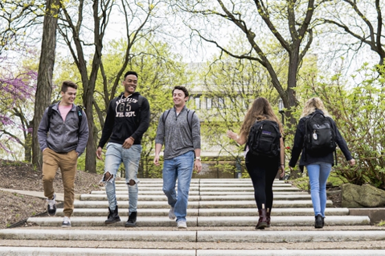 Photo of Chatham University students walking together outside on Shadyside Campus