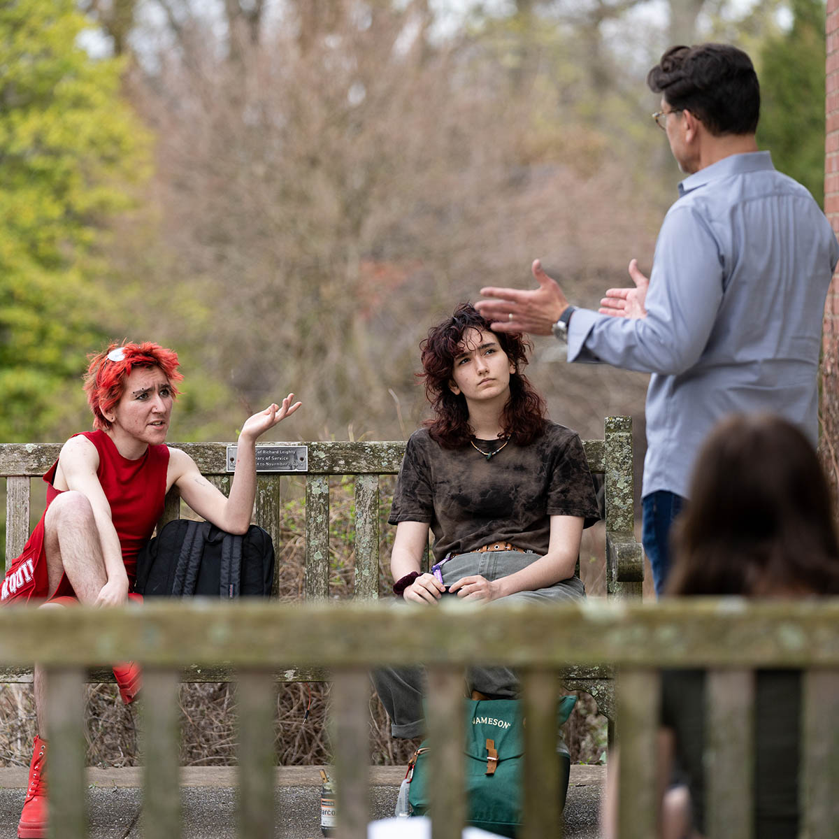 A professor speaks to two Chatham students outside on Shadyside Campus