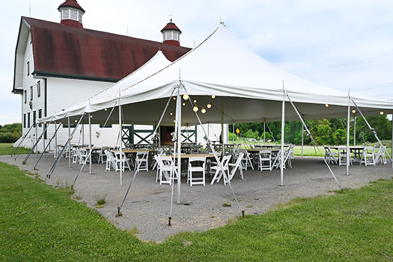 Photo of the large barn and tent on Chatham's Eden Hall Campus