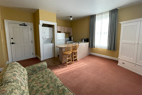 Photo of a living room and kitchenette in the Gatehouse on Shadyside Campus