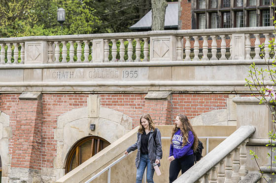 Photo of two Chatham University students walking on Shadyside Campus together