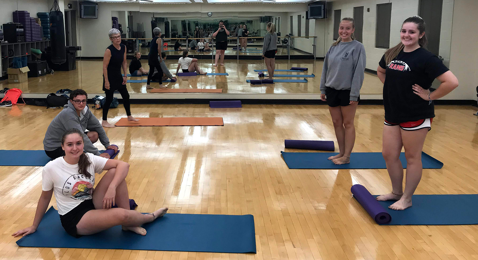 Photo of SLA students in a yoga class
