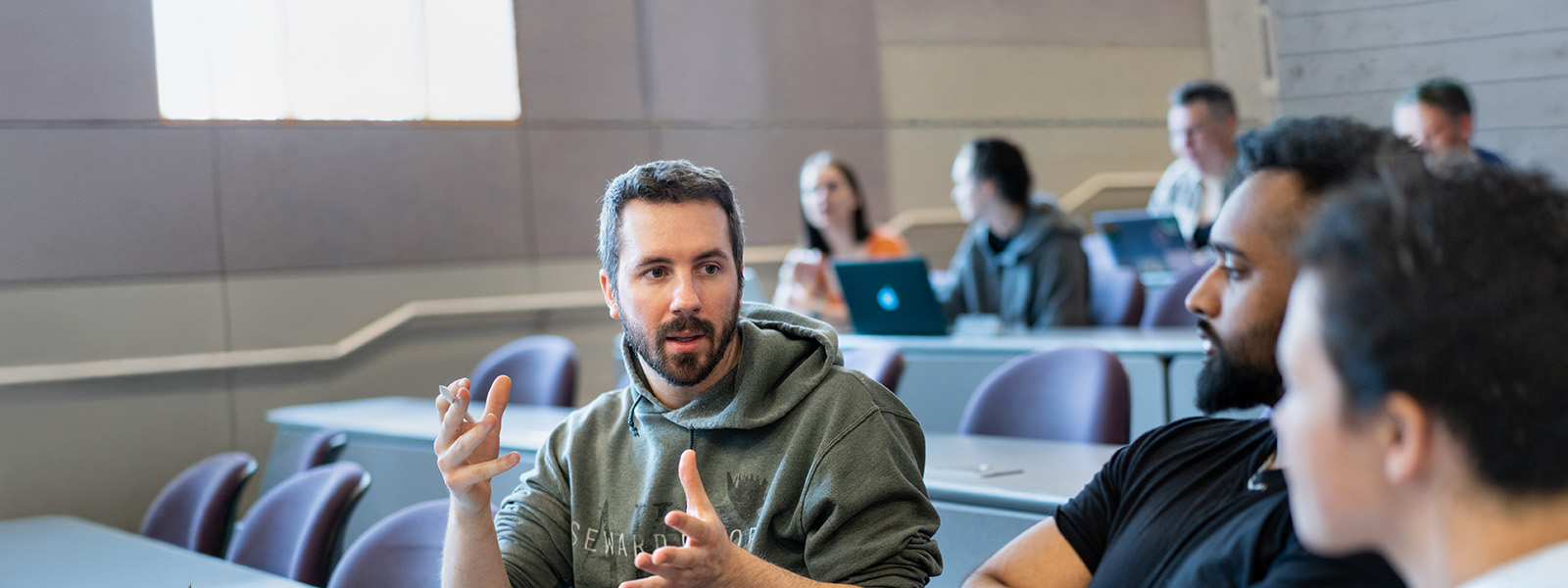 Chatham communication students working in a lecture hall