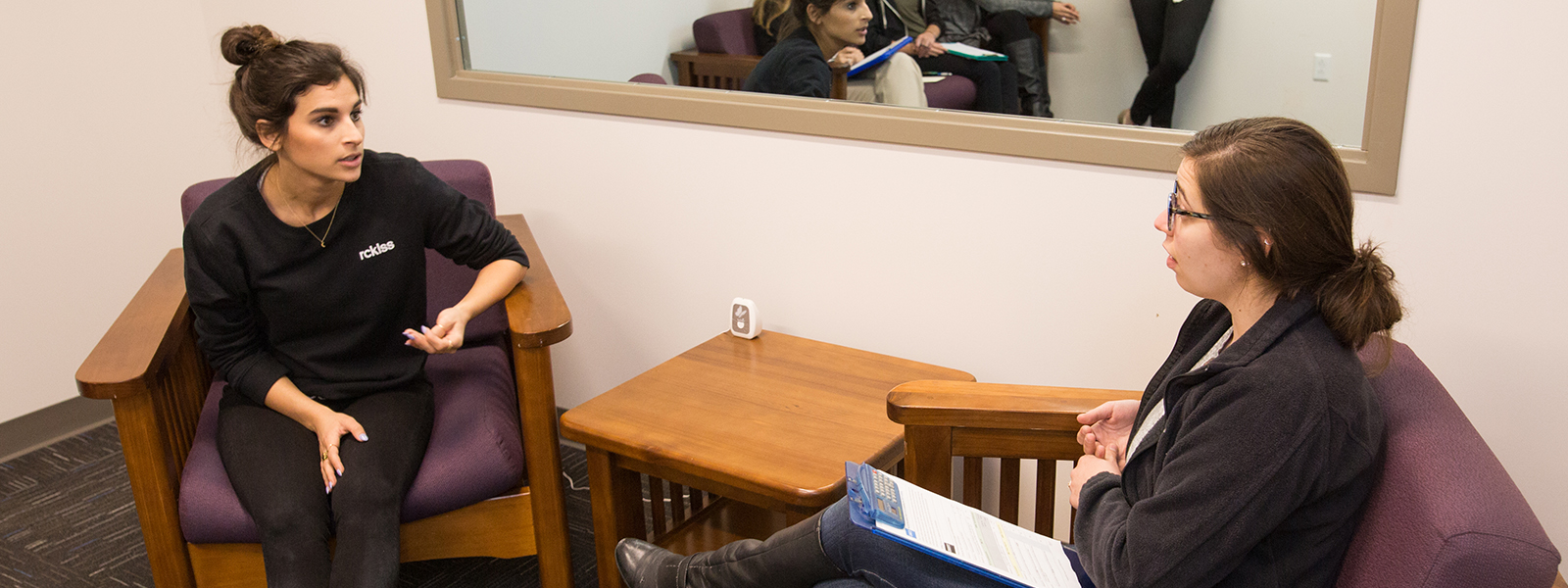 Two counseling psychology graduate students working together