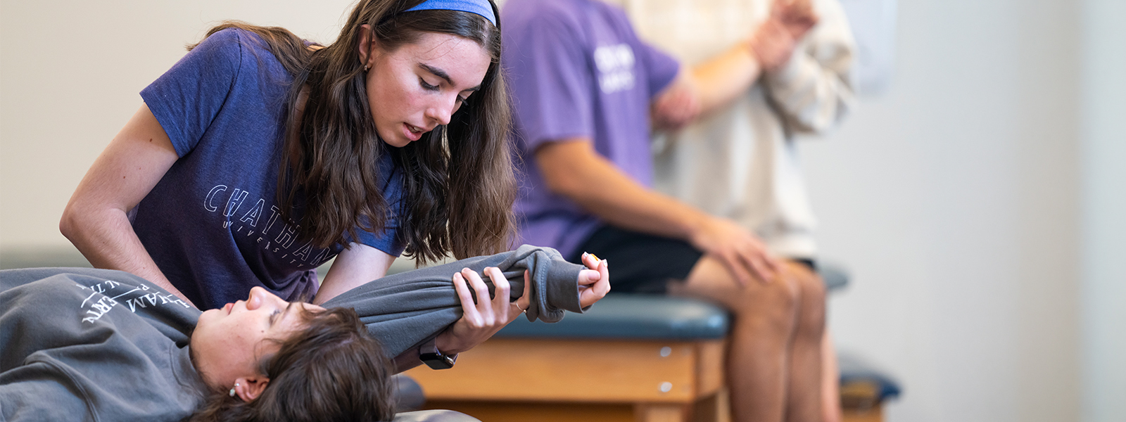 Physician Assistant Studies student testing reflexes in a lab