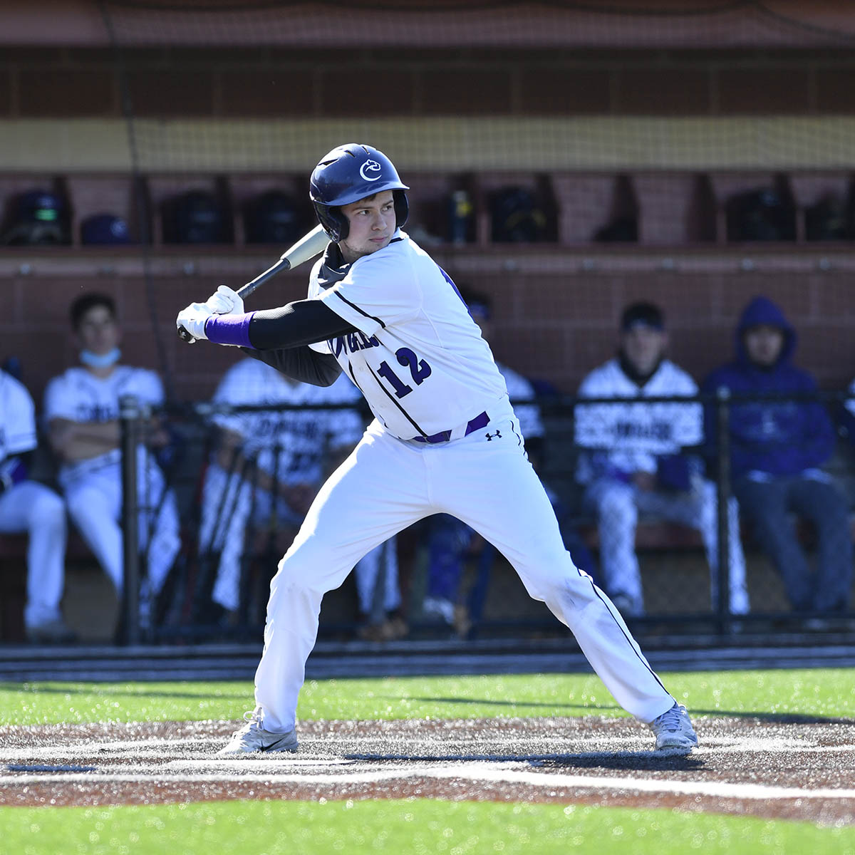 Photo of a young male student in a Chatham baseball uniform at bat